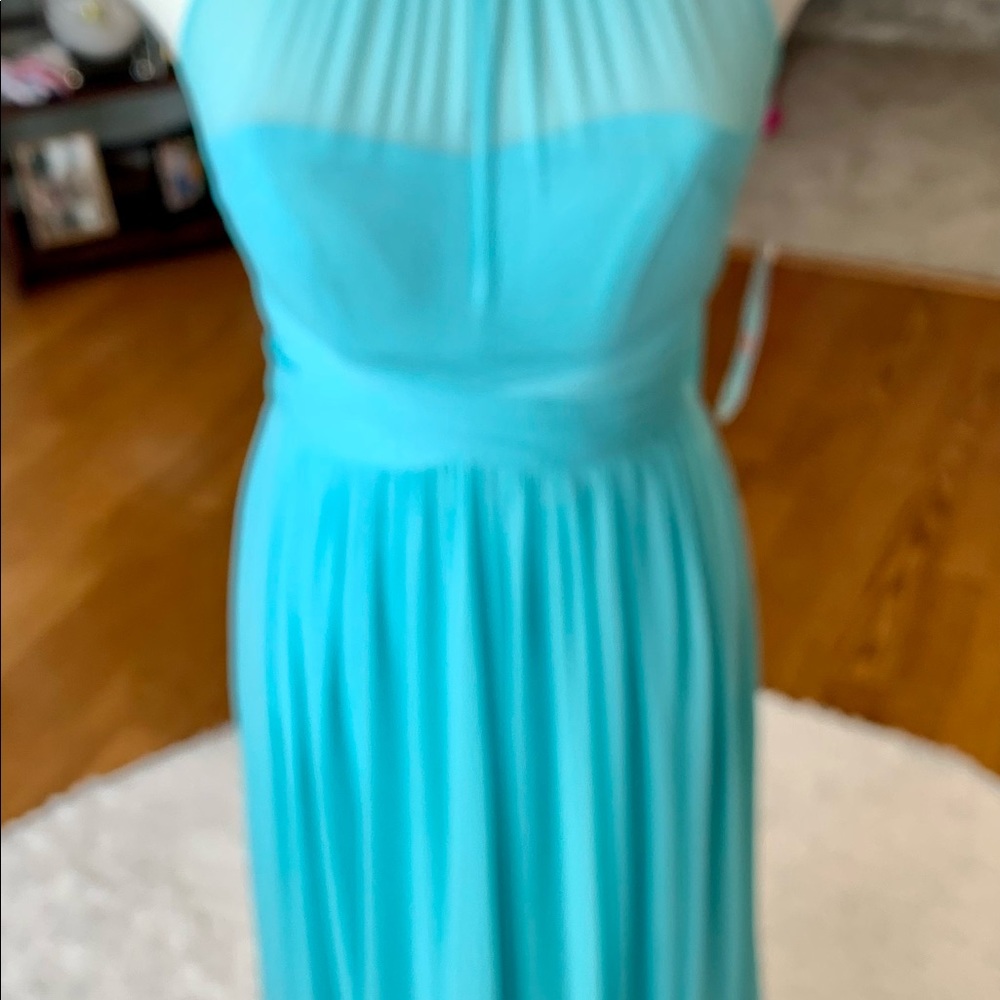 Sweetheart Bodice Halter Style Gown with sheer neck line Flowing Skirt and Sash